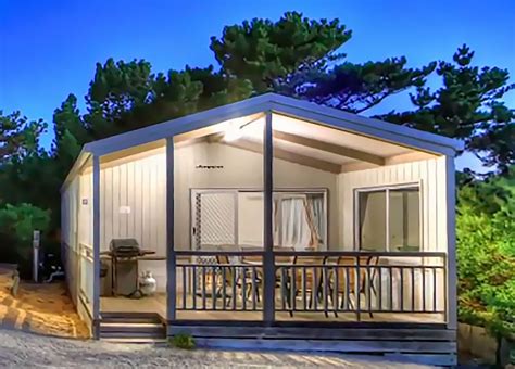 A holiday park is an umbrella term referring to parks or areas that house caravans, cabins, camp sites and mobile homes for short-term let, permanent use, or a mix of the two. . Venus bay caravan park cabins for sale